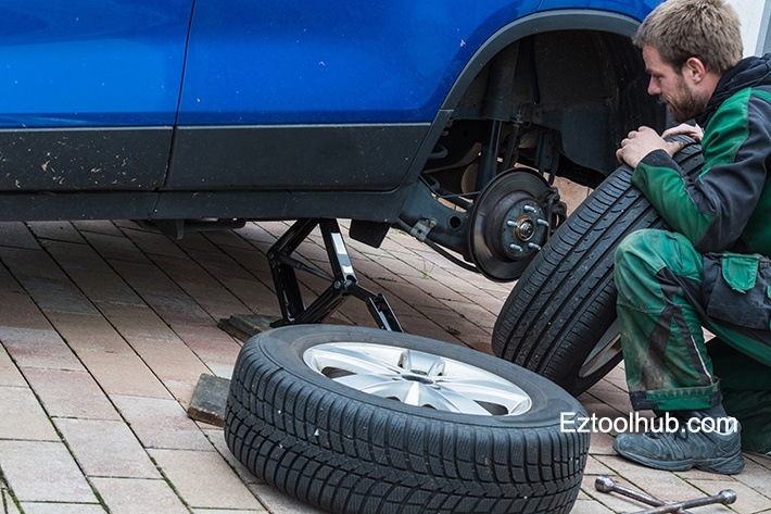 jack up and remove tire on car